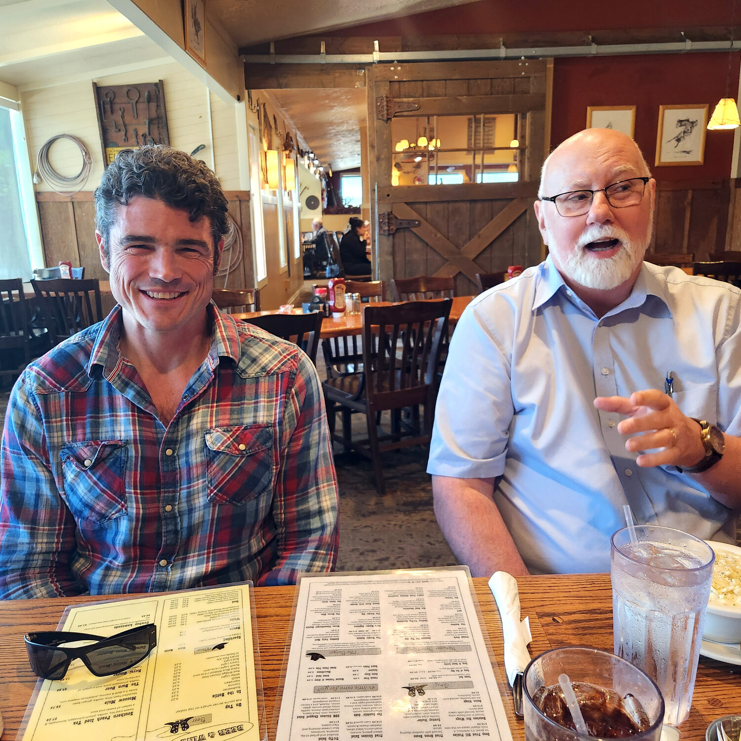 Joe Kent, left, is pictured with Kyle Pratt during an interview with Chronicle columnist Julie McDonald at Ramblin’ Jacks Ribeye in Napavine.